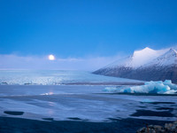 Glacierlagoon at sunset. Moon in background