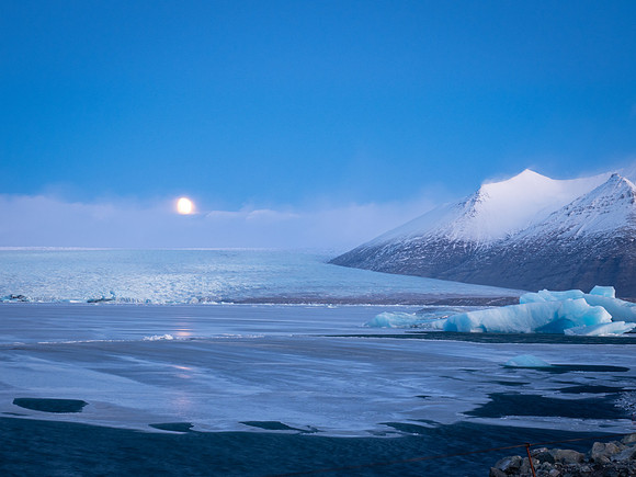 Glacierlagoon at sunset. Moon in background
